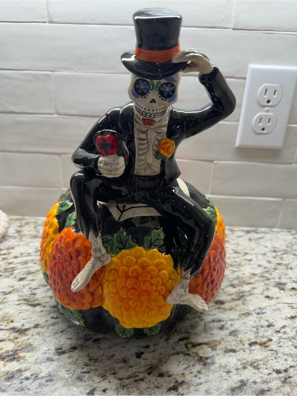 Blue Sky Black Skeleton Figurine with Orange and Yellow Floral Base